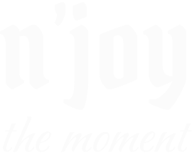 Inspirational text saying 'enjoy the moment'.