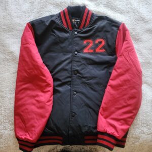 Black and red varsity jacket with number 22 on chest.