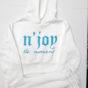 White hoodie with blue text 'n'joy the moment' on front.