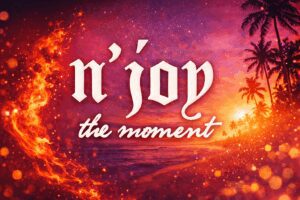 Inspirational text urging to enjoy the present moment with a vibrant sunset background.